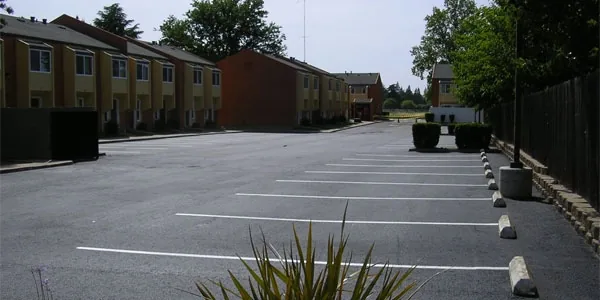 Apartment complex parking lot with new asphalt and stall lines